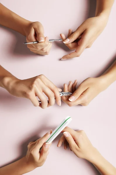 Hands in manicure process — Stock Photo, Image
