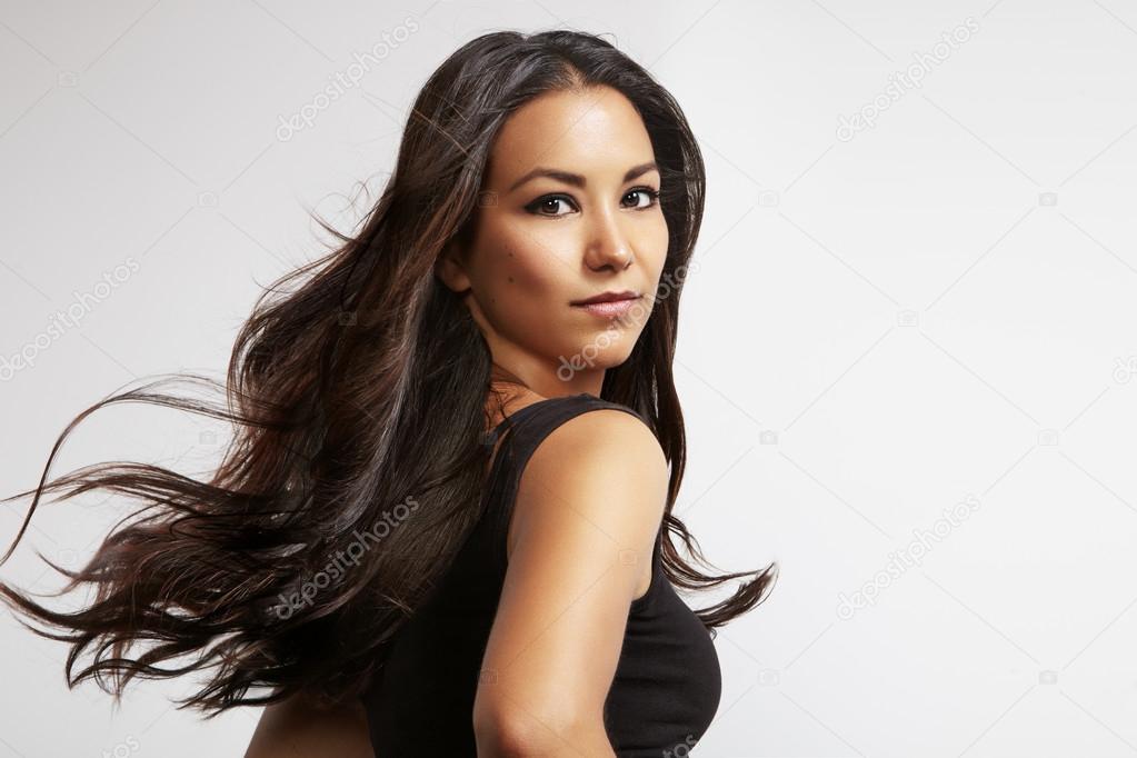 Latin woman with blowing hair