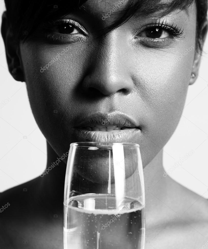 Woman drinking from champagne glass
