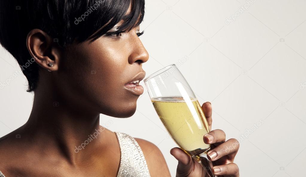 Woman drinking champagne — Stock Photo © kazzakova 60330989