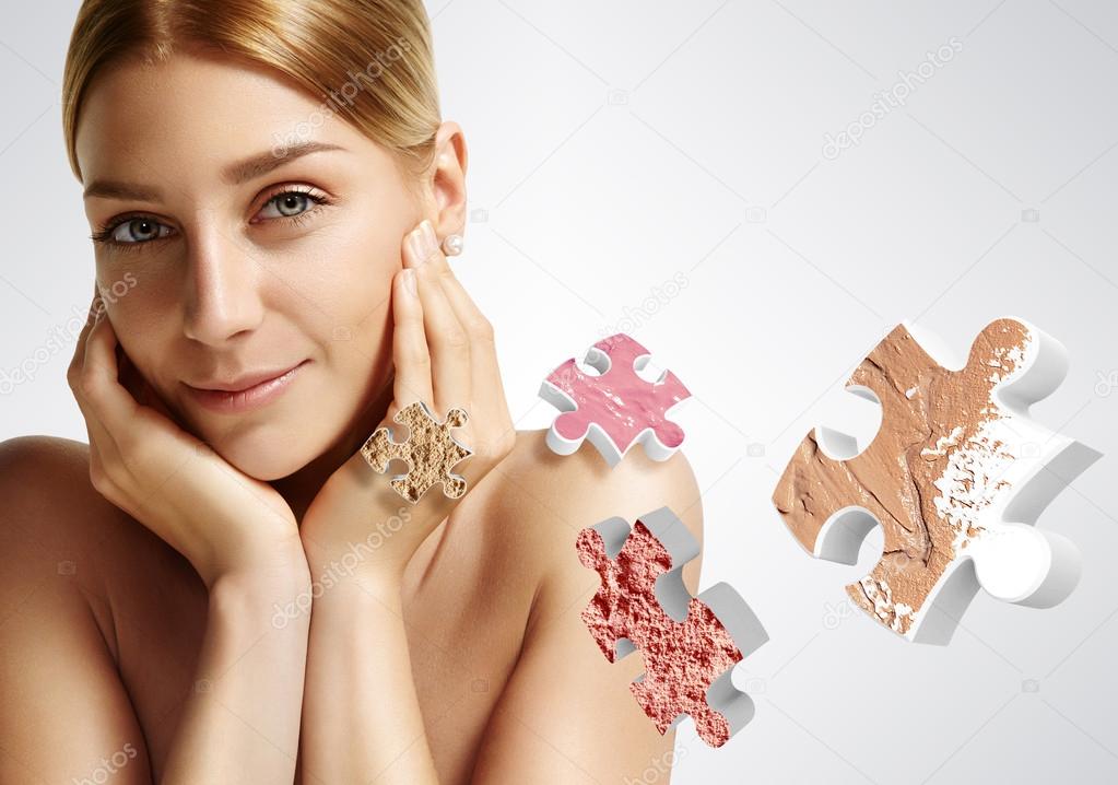 Woman and puzzle with different makeup products