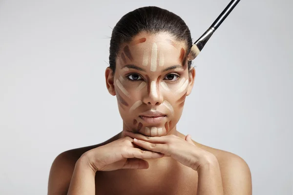 Woman with different shades of foundation — Stock Photo, Image