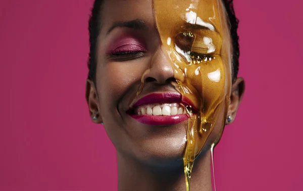 Woman with honey on face — Stock Photo, Image