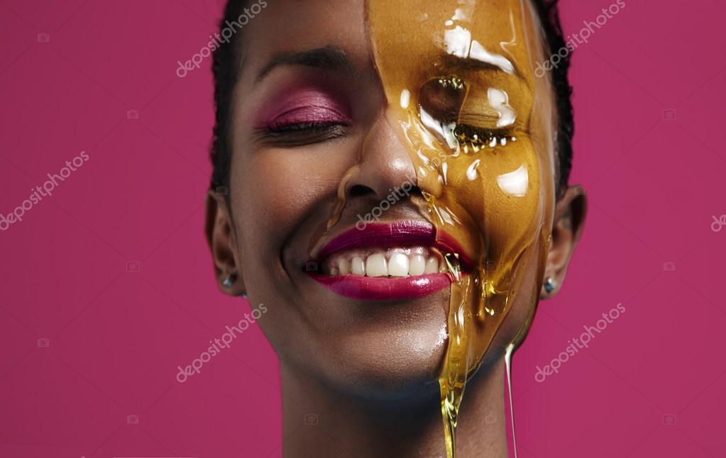 Woman with honey on face — Stock Photo © kazzakova 67799985