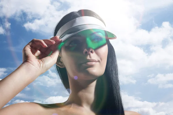 Woman in sun visor — Stock Photo, Image