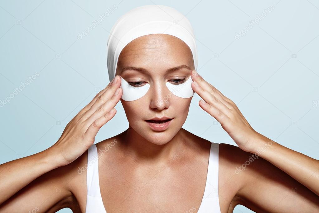 woman with eyes patches