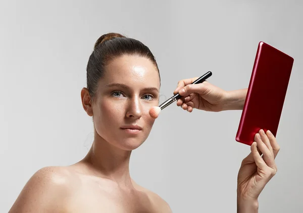 Woman with tablet and brush — Stock Photo, Image