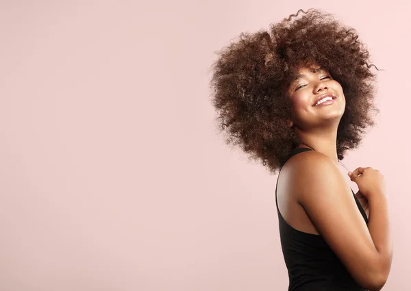Smiling girl with afro hair