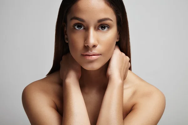 Woman with hands on neck — Stock Photo, Image