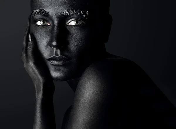 Woman with black painted skin — Stock Photo, Image