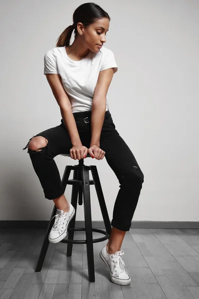 Latin girl siting on chair — Stock Photo, Image