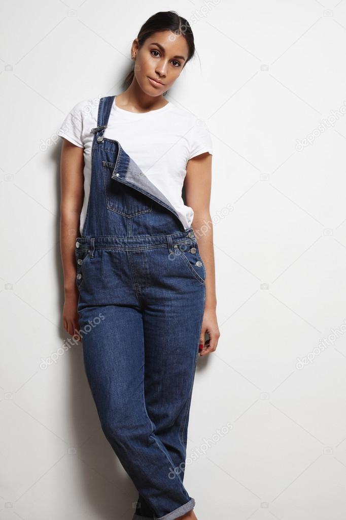 woman wears denim overalls