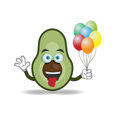 Avokado maskotu bir balon tutuyor. vektör illüstrasyonu