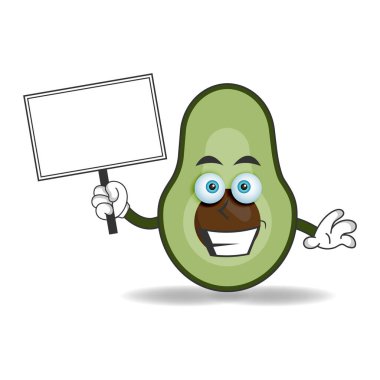 Avokado maskotu karakteri beyaz bir karatahta tutuyor. vektör illüstrasyonu