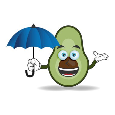 Avokado maskotu bir şemsiye tutuyor. vektör illüstrasyonu