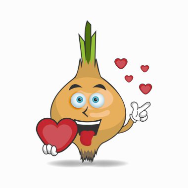 Soğan maskotu karakteri bir aşk simgesi tutuyor.