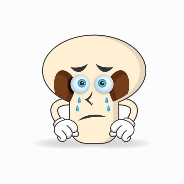 Üzgün ifadeli mantar maskotu karakteri.