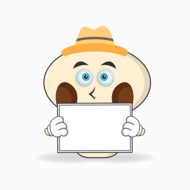 Beyaz bir karatahta tutan mantar maskotu karakteri.