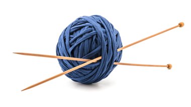 Skeins with wooden Knitting Needles isolated on white