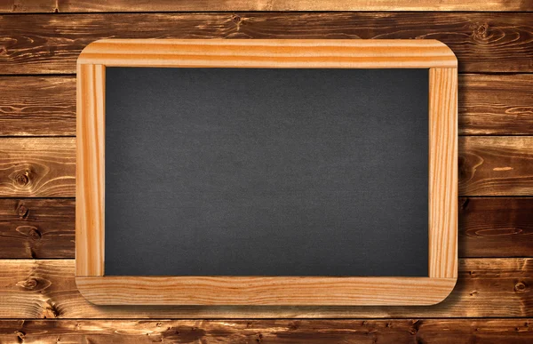 Blackboard on a wood — Stock Photo, Image