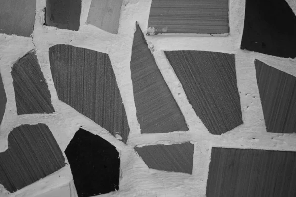 evocative image of black and white mosaic texture with various shapes