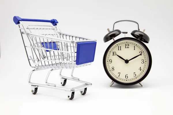 Reloj y carrito de compras —  Fotos de Stock