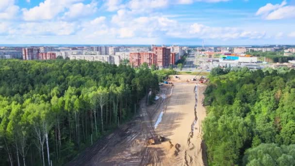 Construction of a new highway. Sand embankment preparation by road machinery — Stock Video