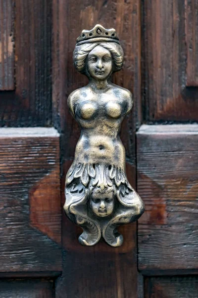 door knocker as a head of the soldier woman