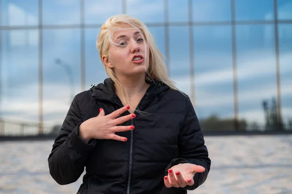 Emotional deaf and dumb woman talking sign language outdoors. — Stockfoto