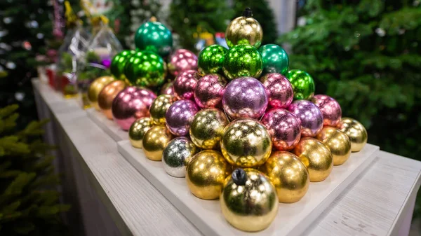 Christmas balls on the stand. Close-up of Christmas toys in a store — Stock Photo, Image