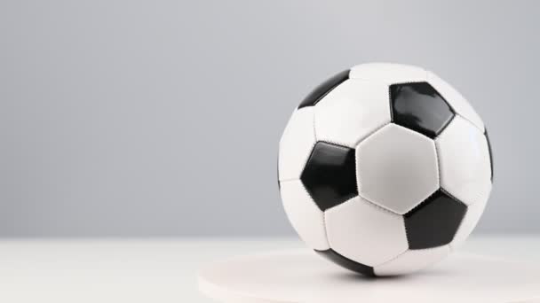 The soccer ball is spinning on a white background — Stock Video