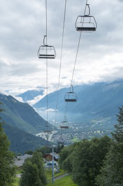 Alpine air lift with Les Houches in the background clipart