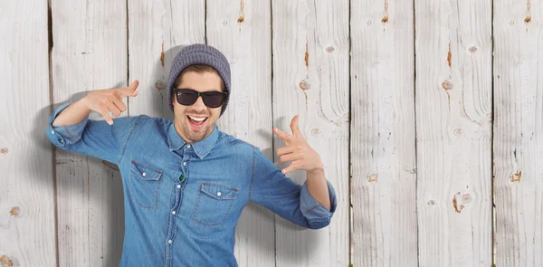 Hipster showing rock and roll hand sign — Stock Photo, Image