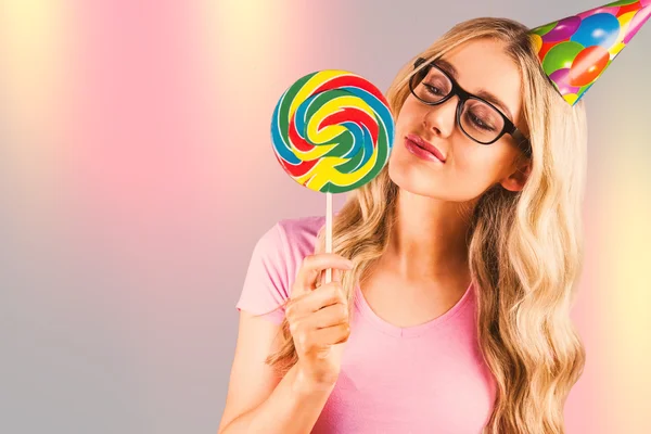 Hipster holding a giant lollipop — Stock Photo, Image
