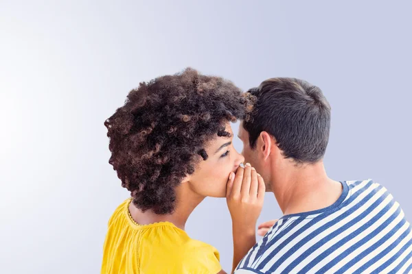 Couple whispering in ear — Stock Photo, Image