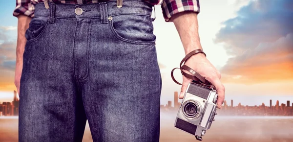 Hipster man holding digital camera — Stock Photo, Image