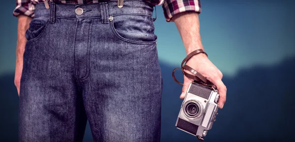 Hipster man holding digital camera — Stock Photo, Image