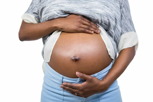 Zwangere vrouw raakt haar buik aan — Stockfoto