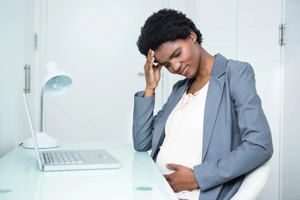 Pregnant businesswoman feeling sick — Stock Photo, Image
