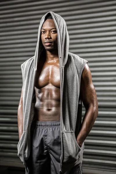 Standing shirtless man with grey jumper — Stock Photo, Image