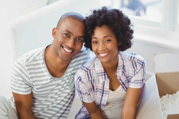 Happy couple opening boxes — Stock Photo, Image