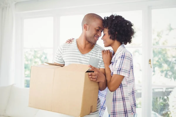 Happy couple opening boxes — Stock Photo, Image