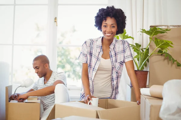 Happy couple opening boxes — Stock Photo, Image