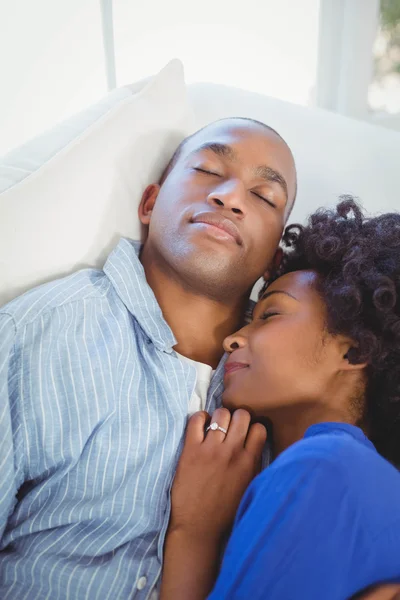 Peaceful couple sleeping on the sofa — Stok fotoğraf