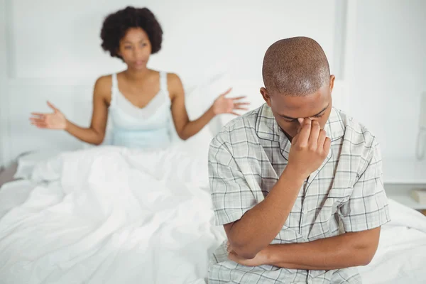 Upset man sitting on bed after argument — Stock Photo, Image