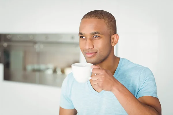 Handsome man holding cup — Stock Photo, Image