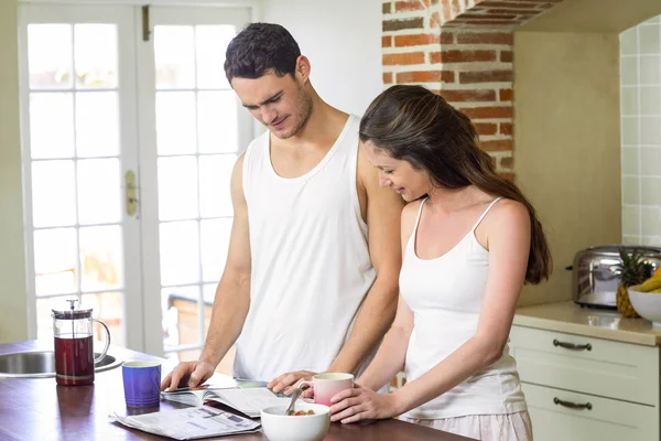 Young couple looking their personal organizer — 스톡 사진