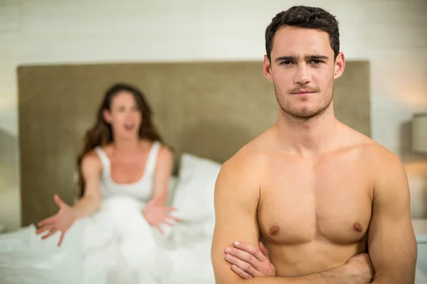 Upset couple sitting on bed — Stock Photo, Image