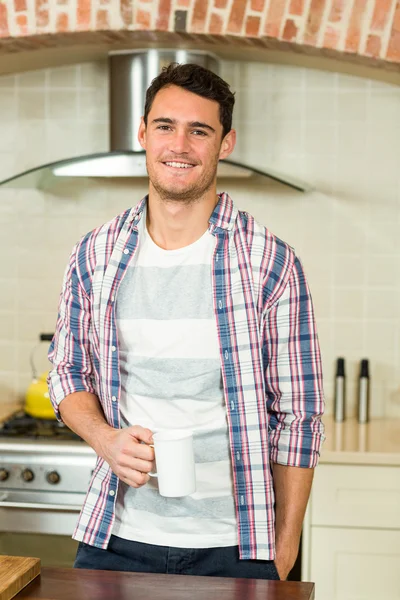 Portrait of young man holding a cup of tea — Stock Photo, Image