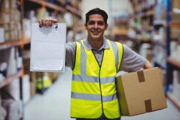 Smiling worker showing clipboard — Stock Photo, Image